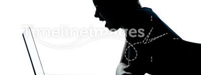 Young teenager boy or girl silhouette computer lap