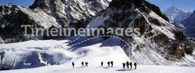 Sherpas crossing an Himalayam glacier