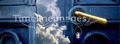 Door to heaven. Open old blue door to heaven with brass handle. The sky and clouds invite You to a dream. Behind doors You find the power and happiness