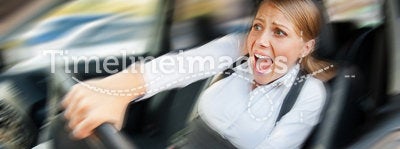 Female driving the car and screaming