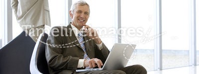 Mature businessman with laptop