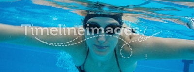 Underwater swimming woman