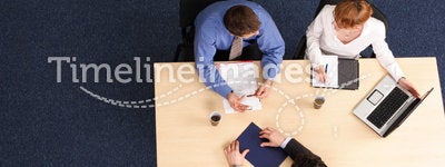 Three business people meeting