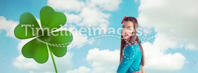 Woman watering a four leaf clover