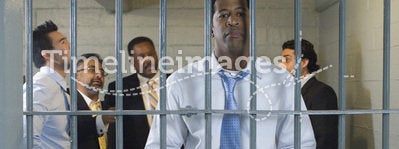 Group Of Men In Prison Cell