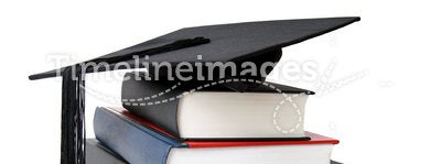 Graduation mortar on books