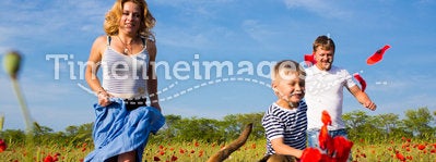 Family on the poppy meadow