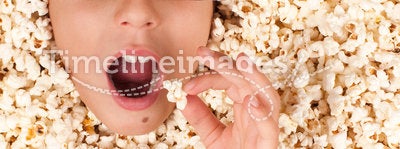 Little girl buried in popcorn