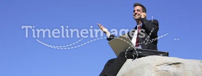 Businessman on a rock