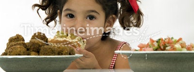 Girl eating falafel