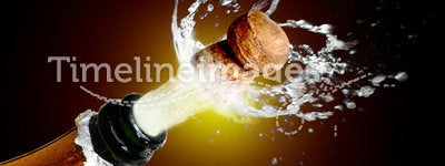 Close up of champagne cork popping