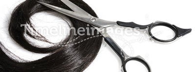 Black hair and scissors