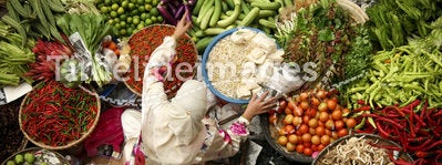 asian woman working fresh fruit and vegetable market