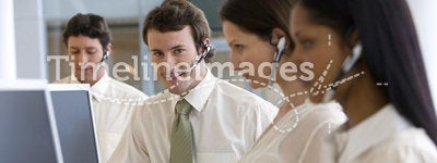 Young businessman in call center