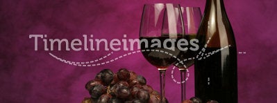 Horizontal of Wine bottle with glasses and grapes
