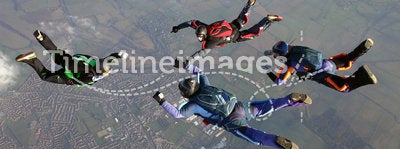 Four Skydivers form a formation