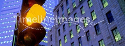 Amber traffic light in city
