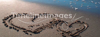 Two hearts on the beach 2