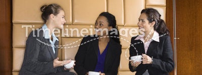 Businesswomen drinking coffee.