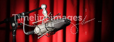 Vintage Microphone Over Red Curtain