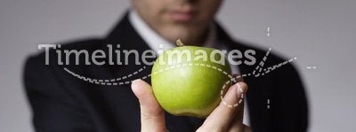 Businessman holding apple