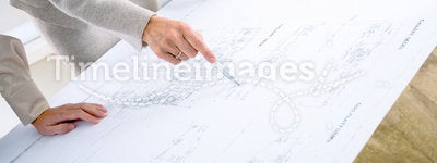 Architects planning on blueprint