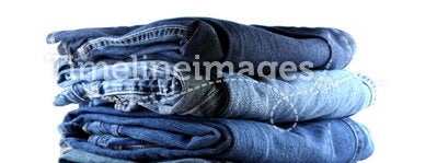 Stack of five blue jeans