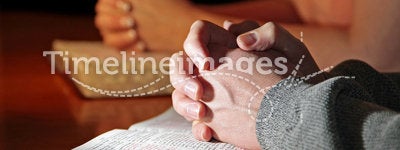 Couple Praying Bibles