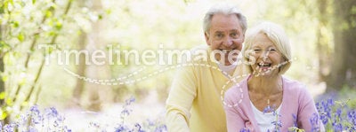 Senior couple in bluebell woods
