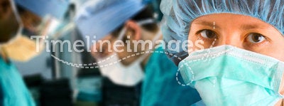 Female surgeon with surgical team