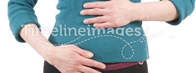 Young woman touching stomach