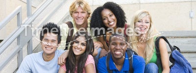 Group of university students sitting on steps