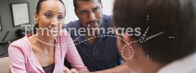 Couple having discussion with doctor in IVF clinic