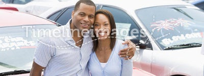 Couple looking at new cars