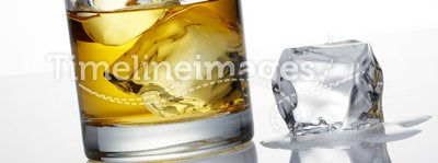 Whisky and ice cube