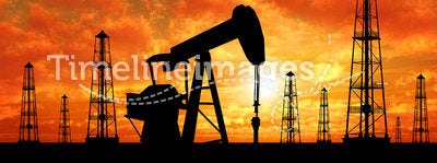 Silhouette oil rigs and pumps