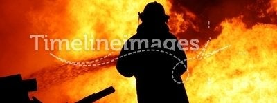Fireman controlling a huge fire
