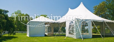 White party or event tent on lawn