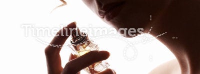 Woman smelling perfume