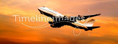 Airliner taking off at sunset