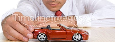 Man with red toy car