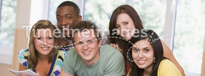 Group of college students leaning on banister
