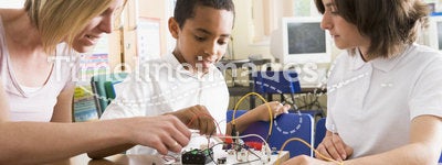 Schoolchildren and their teacher leanring science