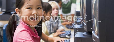 Children learning how to use computers.