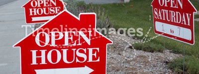 Red and white open house signs