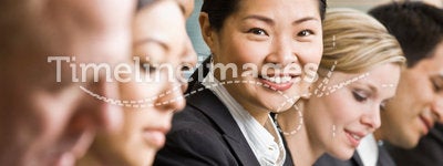 Multi-ethnic co-workers sitting in a row