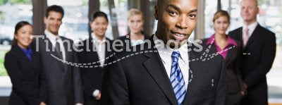 African businessman using cell phone