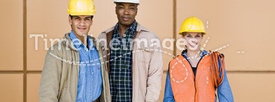 Multi-ethnic construction workers posing