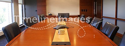 Corporate board room table with chairs.