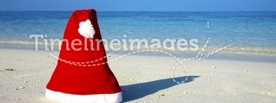 Christmas hat on a beach